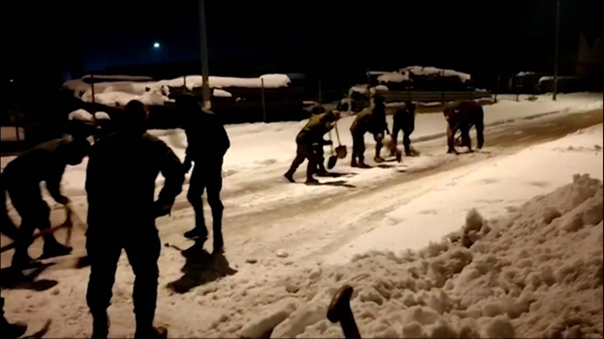 In the village of Valdemorillo, Spain, 40 kilometers from Madrid, the Spanish military continues to clear snow from roadways on Jan. 15. The region was blanketed with snow by storm Filomena, the worst in decades.