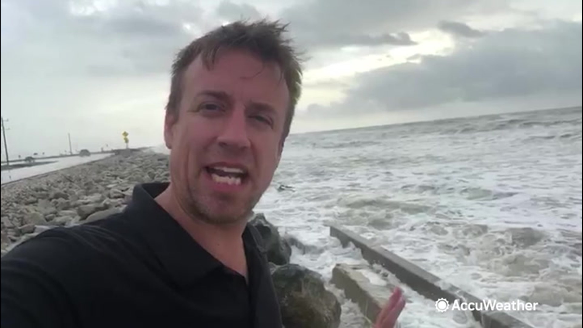 Extreme meteorologist Reed Timmer reports on the shores of the Bolivar Peninsula on August 26, where Hurricane Laura begins its approach.