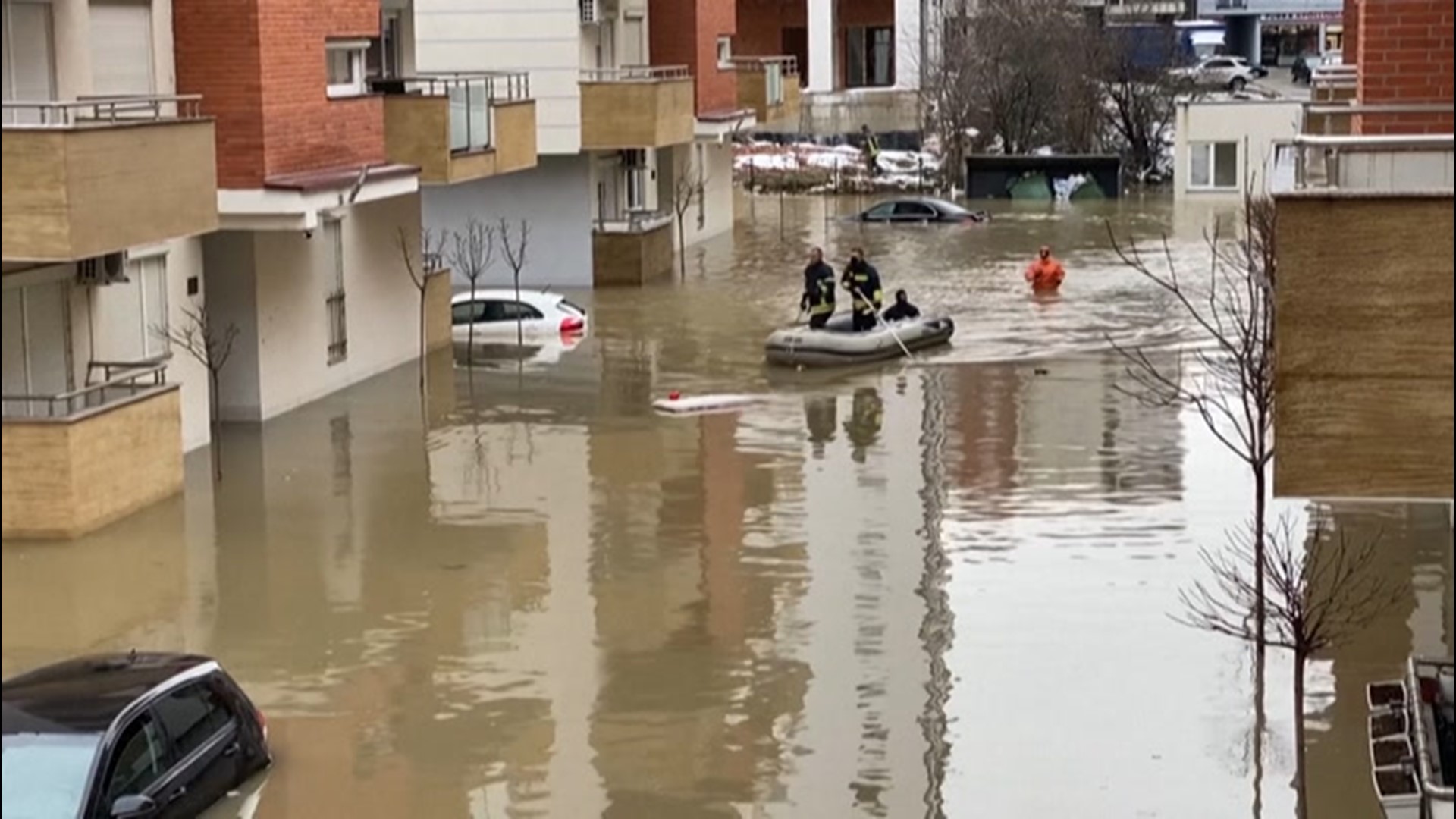 Days of heavy rain and snow sparked flooding that submerged cars, knocked down bridges and inundated farms throughout Kosovo and neighboring Albania on Jan. 11.