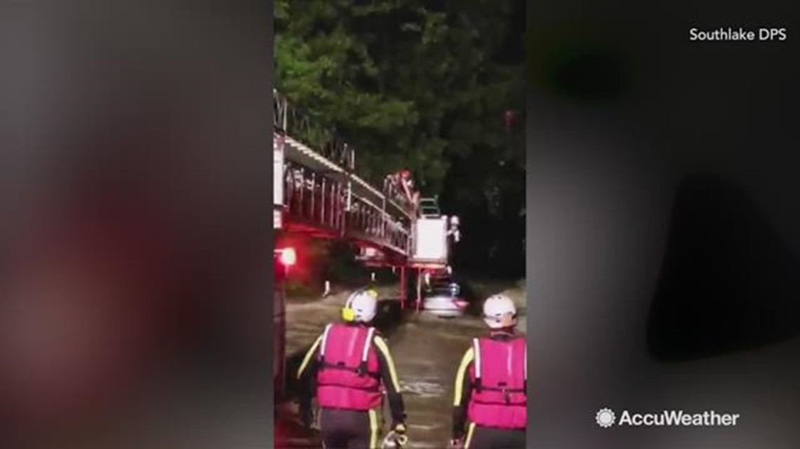 Texas family rescued after car gets trapped by raging floodwaters ...