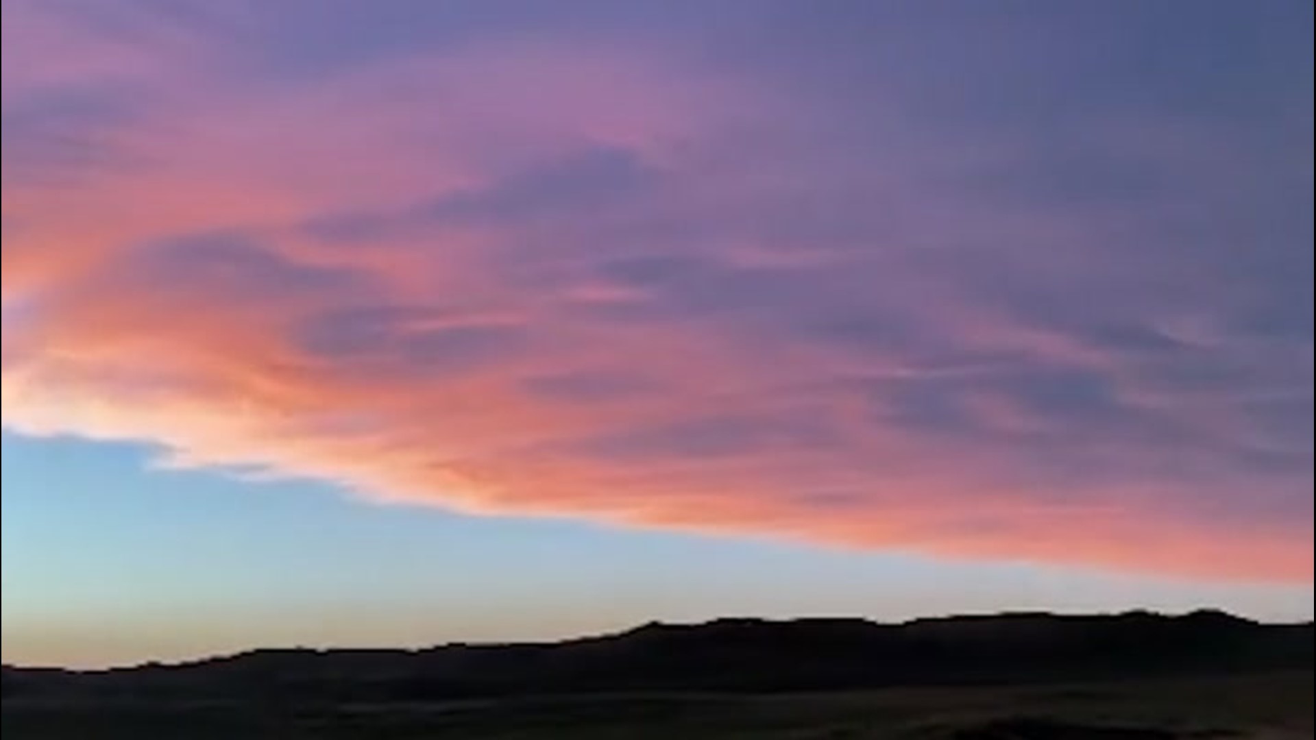 While filming in Merriman, Nebraska, one weather enthusiast was able to catch both a lightning storm and a fantastic sunset, on July 10.