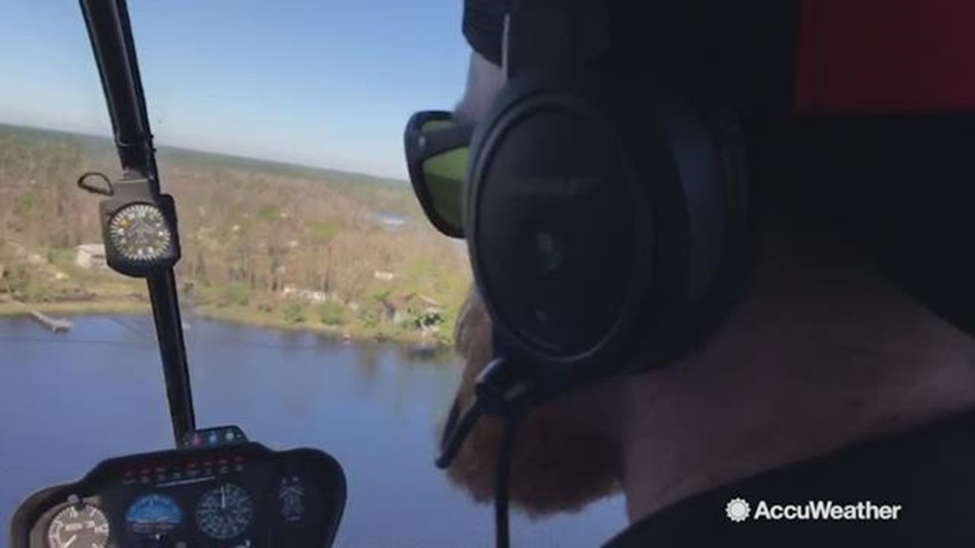 AccuWeather's Reed Timmer and helicopter pilot Rueben Floyd drop off supplies to a family on a bayou in Panama City that are cut off from the outside by flood waters and storm surge.