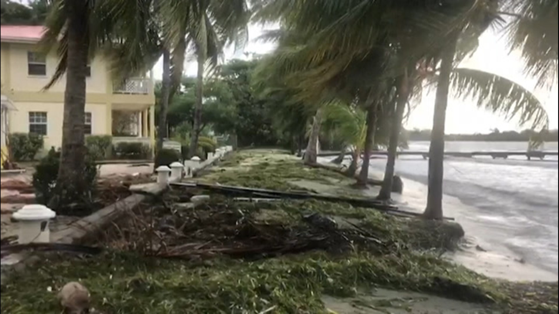 Placencia, Belize, residents clean up fallen branches among other damage inflicted by Hurricane Nana on Sept. 3.