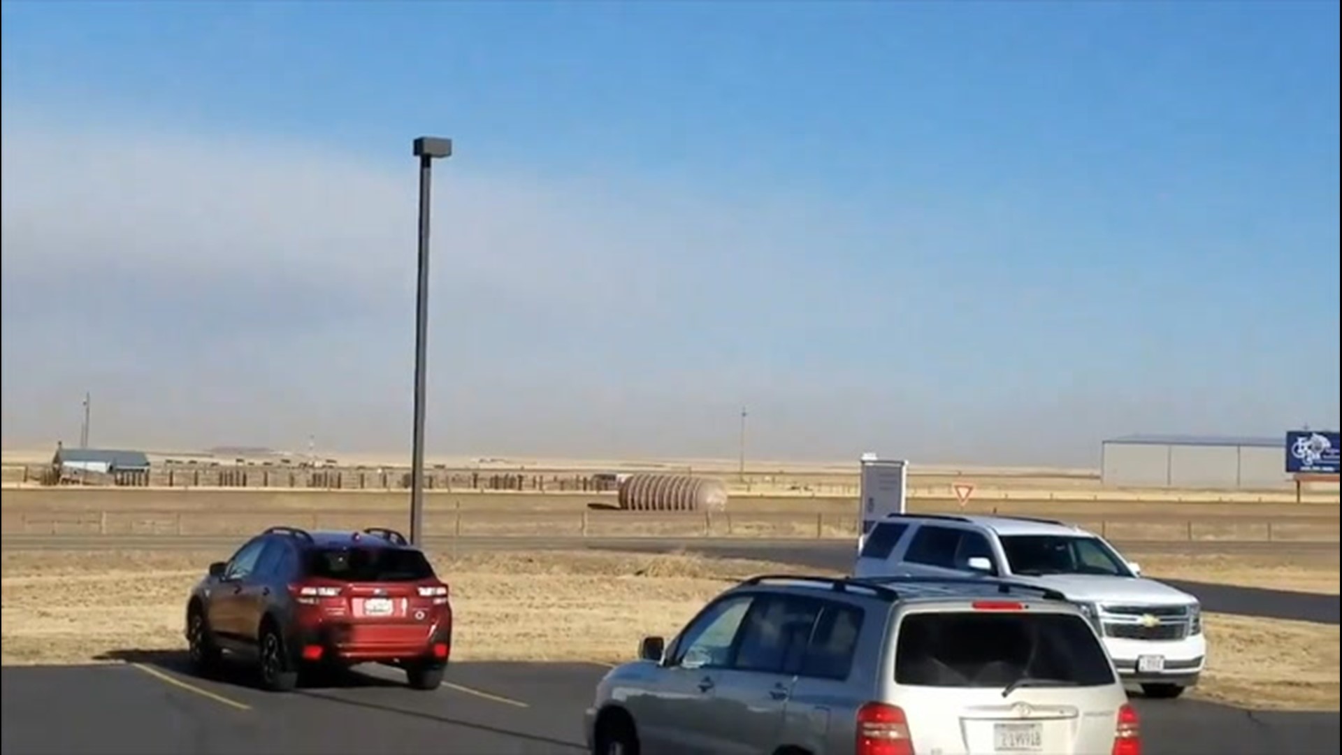 High winds blew large containers into a highway sign and across an active highway in Great Falls, Montana, on Jan. 13.