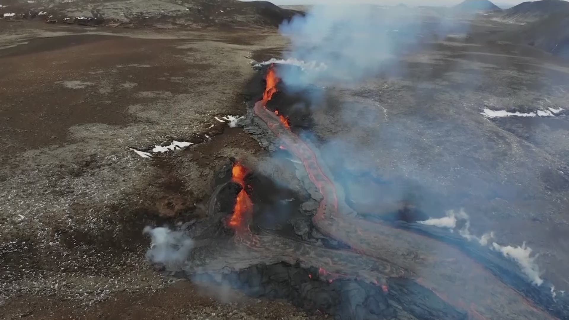 Steam and lava spurted Monday from a new fissure at an Icelandic volcano that began erupting last month.