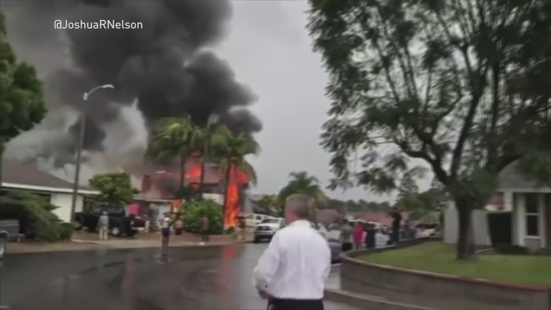 A small plane crashed into a Southern California house on Sunday afternoon, killing two people and injuring two others. (@JoshuaRNelson via AP)