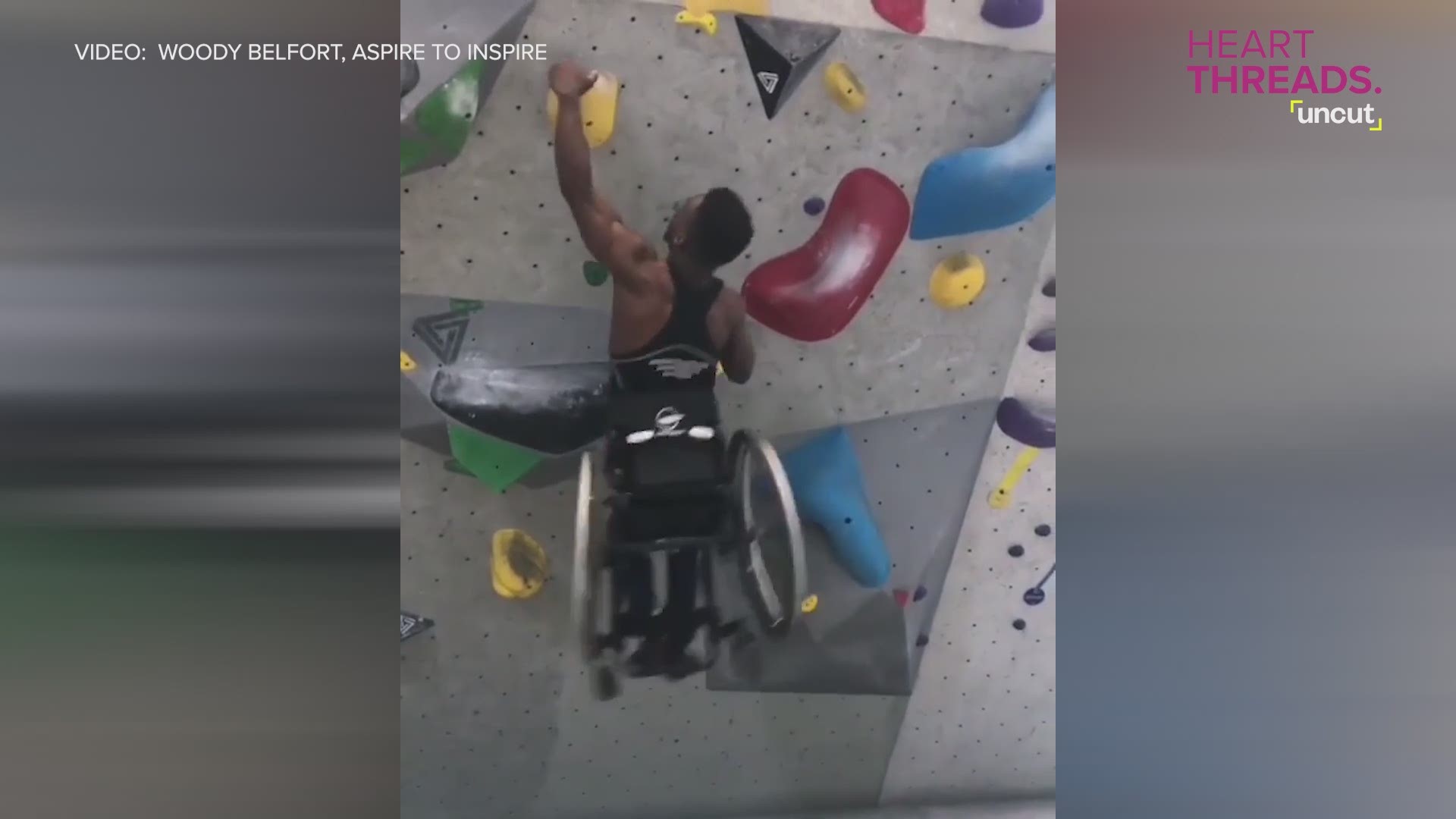 Athlete Woody Belfort scales an indoor rock wall in his wheelchair.