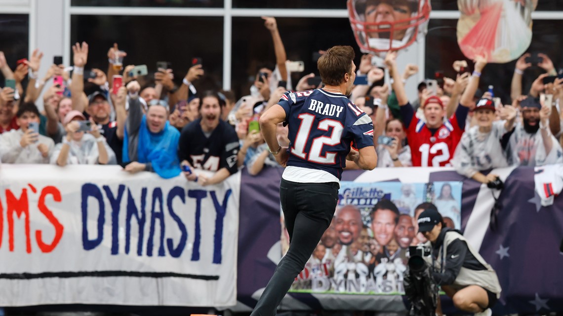 New England Patriots quarterback Tom Brady greets members of the U.S.  military along the sideline before an NFL football game against the Atlanta  Falcons, Sunday, Oct. 22, 2017, in Foxborough, Mass. (AP