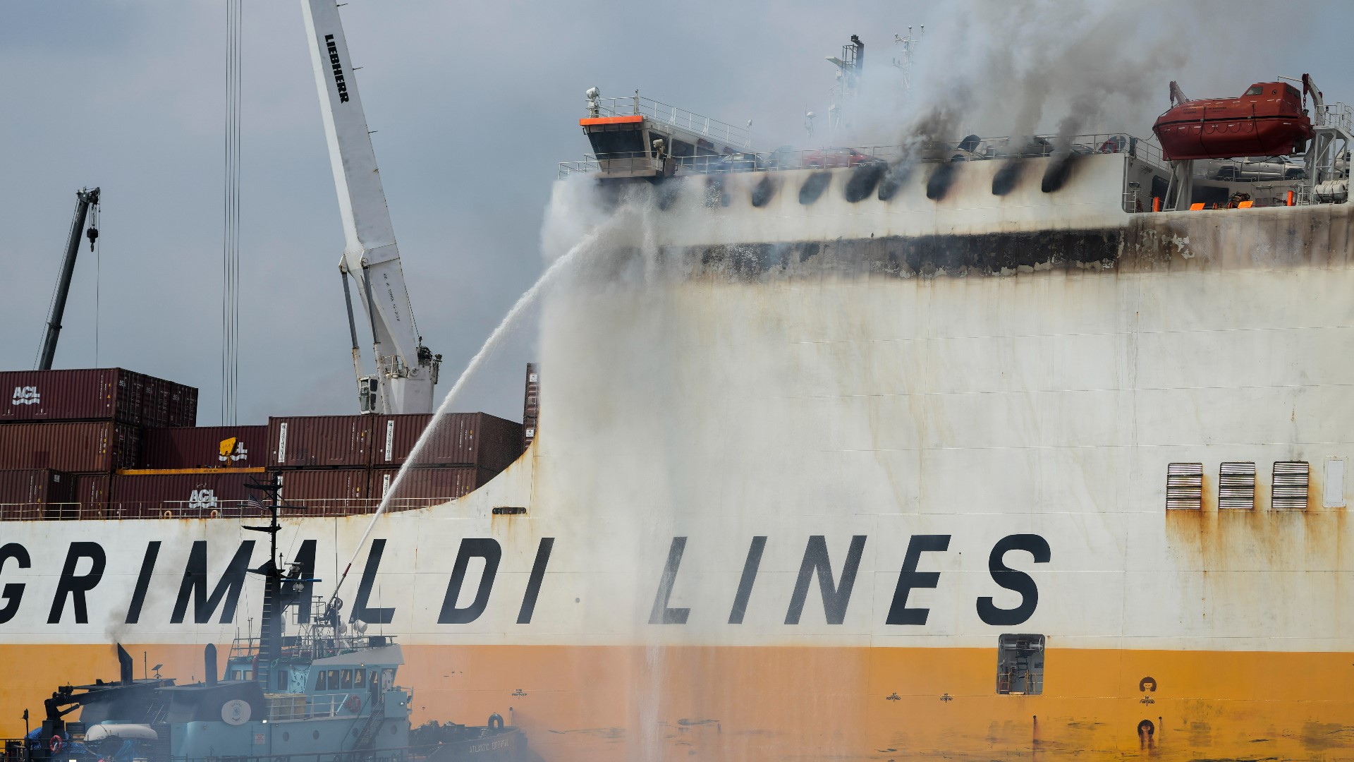 A cargo ship burned for a third day Friday at a New Jersey port after the fire claimed the lives of two firefighters.