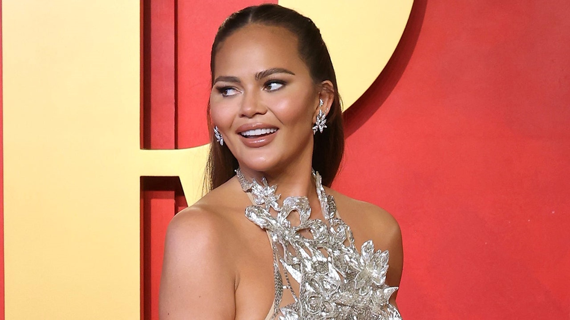 Chrissy Teigen Shows Off Her Boob Lift Scars in Sheer Dress | 9news.com