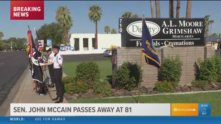 Honor guard stands outside Phoenix mortuary holding Sen. McCain's body