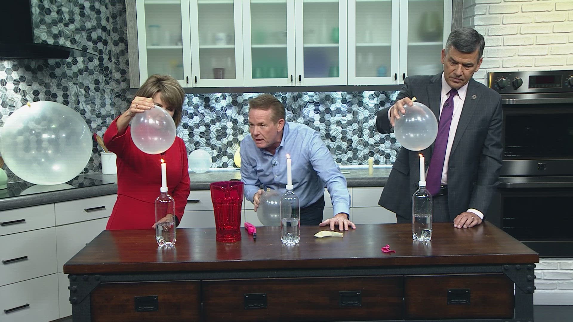 Steve Spangler has fun with candles, balloons and little bit of water.