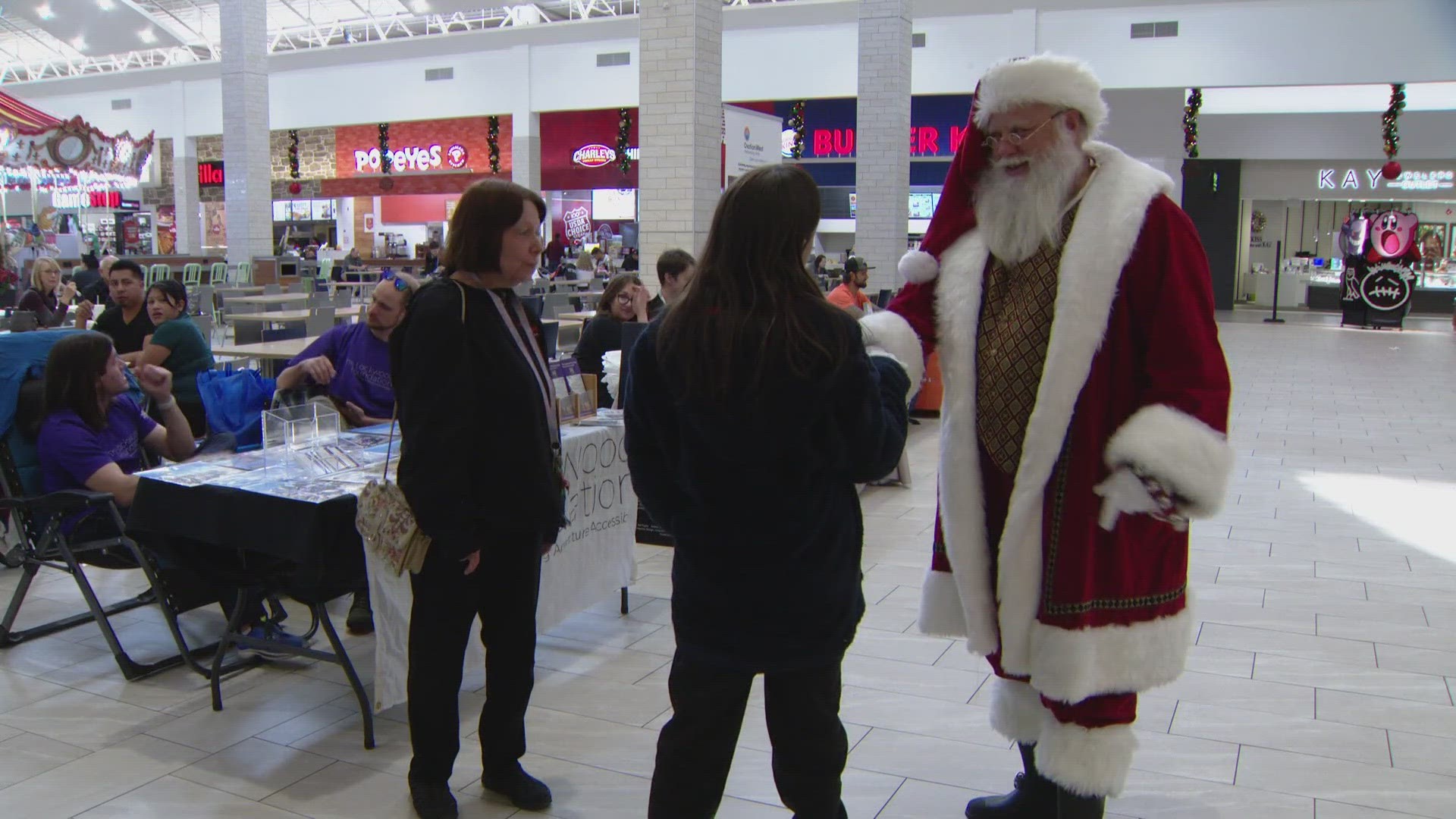 Santa Claus temporarily left his post Tuesday to visit Colorado Mills Mall in Lakewood, where nonprofits were set up to bring awareness to Colorado Gives Day.