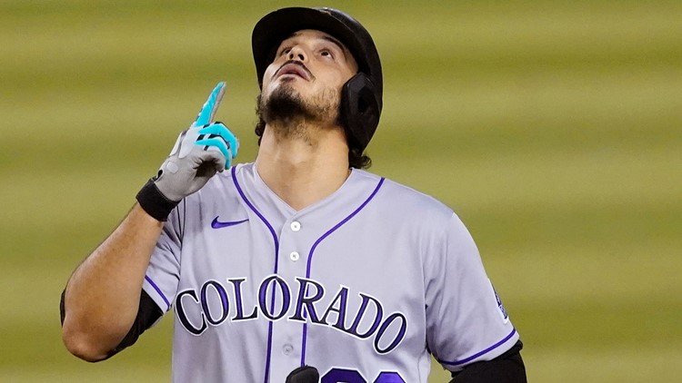 Slumping Nolan Arenado sits for a day, Rockies miss his glove in