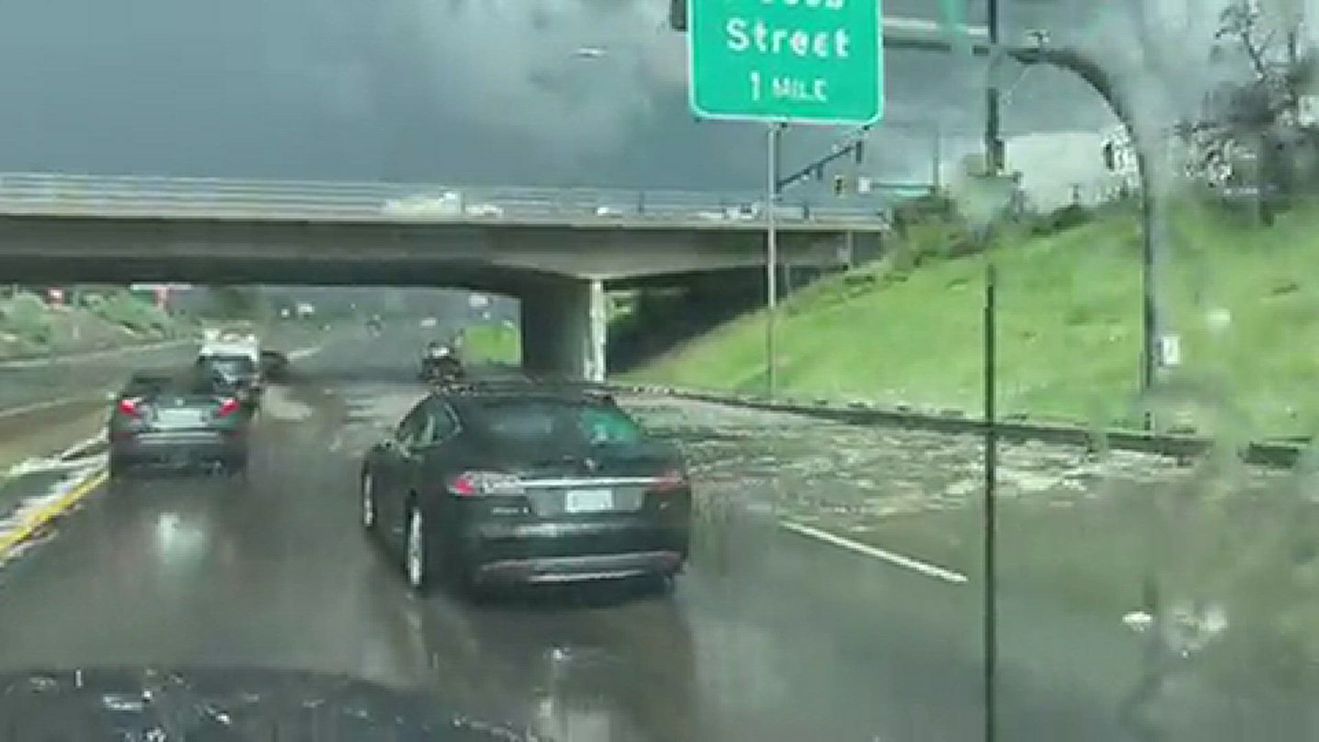 Afternoon commuters were hit with severe weather in the metro area near downtown which caused flooding on interstates and underpasses.