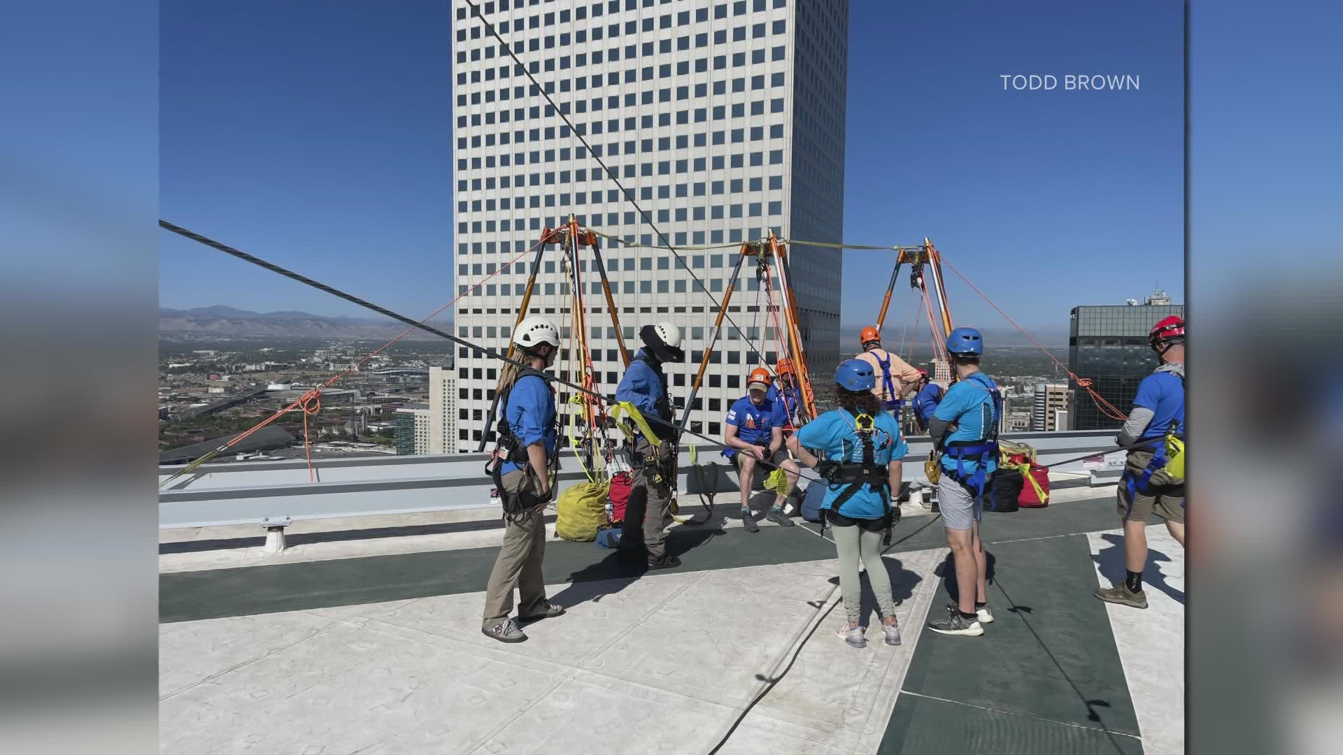 Participants in 'Over the Edge' raise $1500 in pledges and then rappel down one of Denver’s skyscrapers -- all while raising money for cancer research in Colorado.