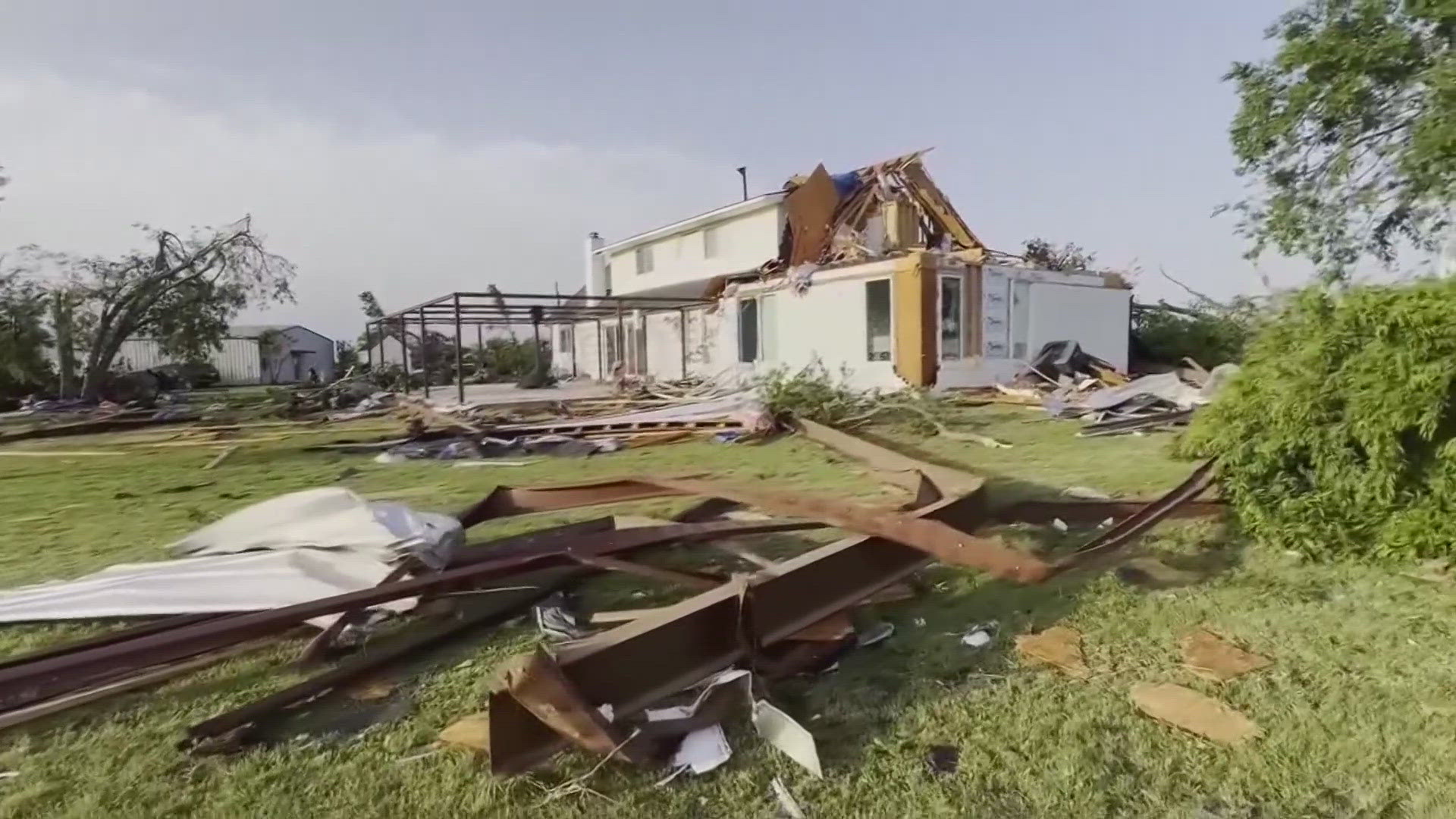 At least 21 people were killed as storms obliterated homes and destroyed a truck stop where drivers took shelter.