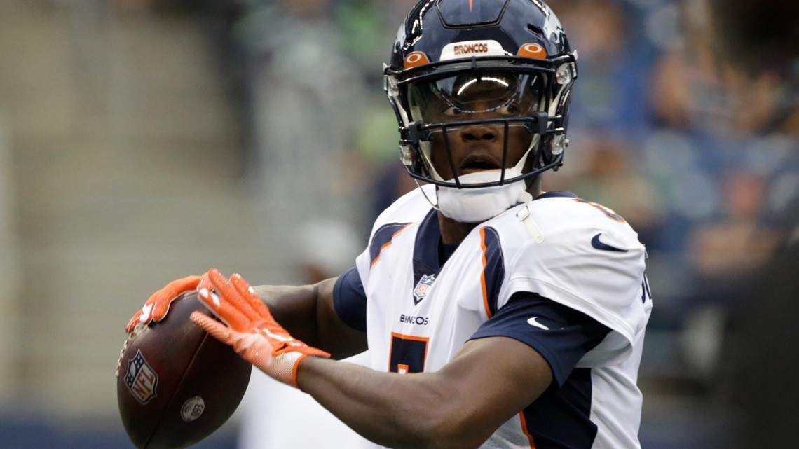 Denver Broncos' Shaun Beyer smiles while on the bench against the