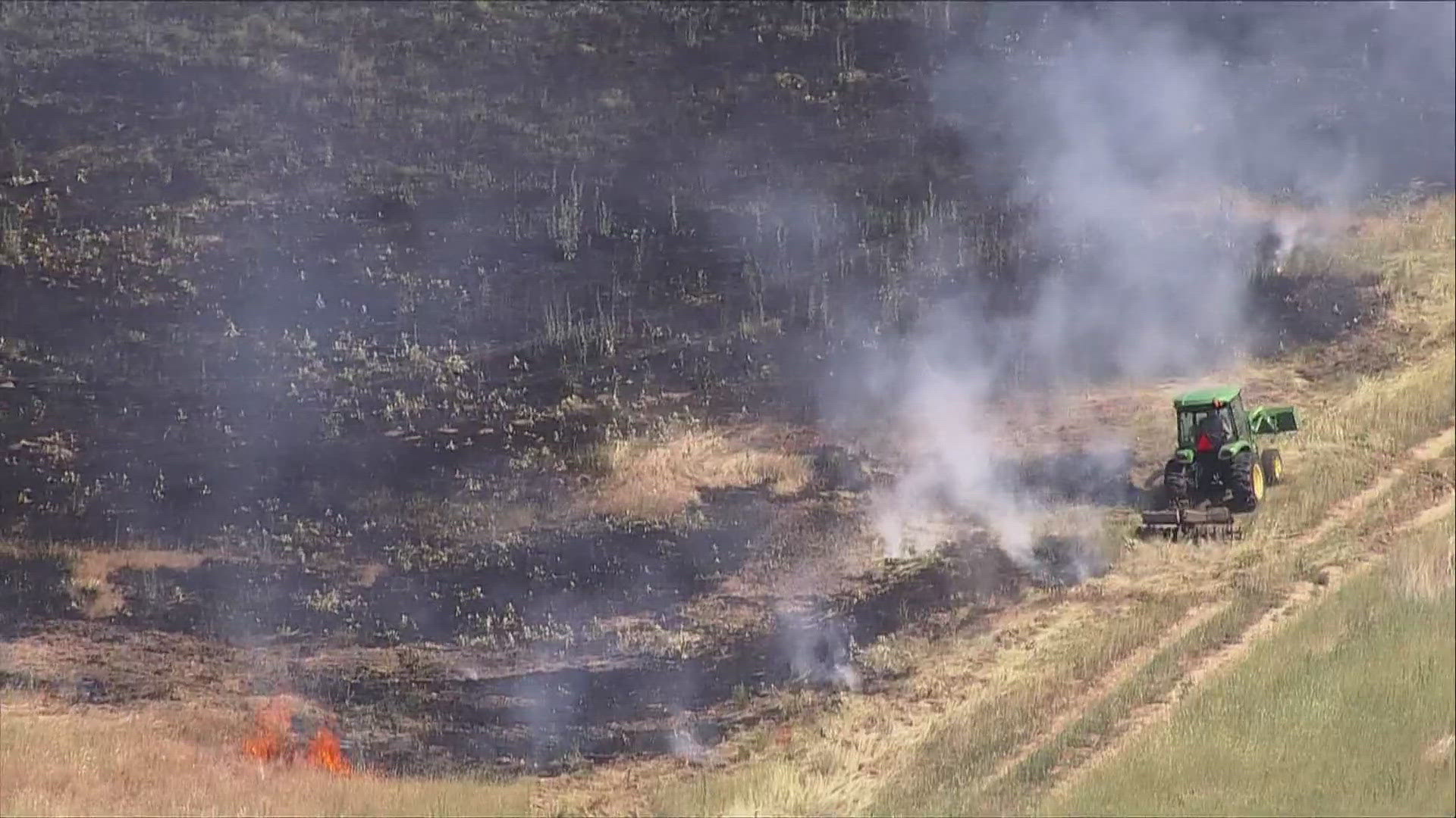 A brush fire wildfire is burning at Barr Lake State Park near Brighton in Adams County northeast of Denver Tuesday afternoon. Smoke visible from wildfire.