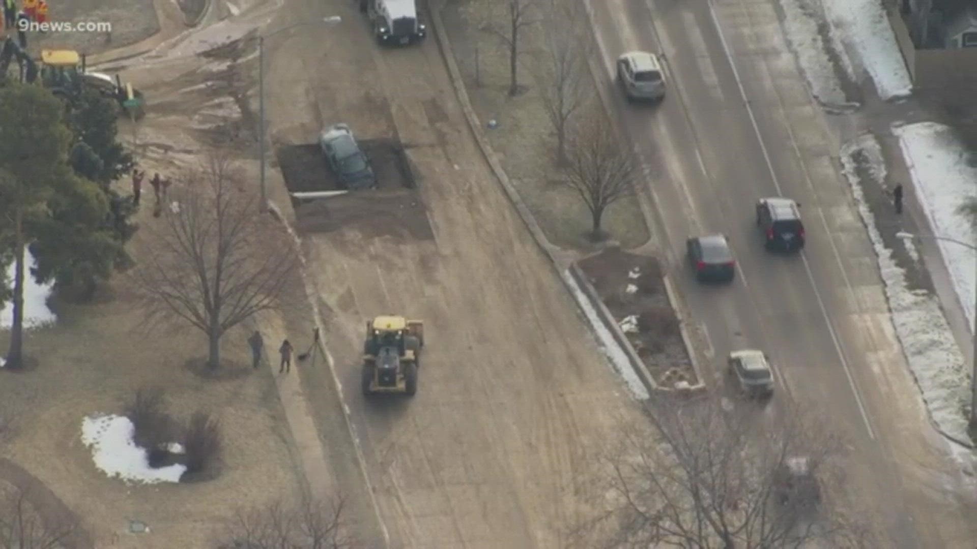 SKY9 over the area where a man drove into a hole that was part of a water main break repair.