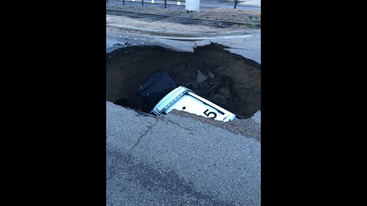 Sinkhole Swallows Suv With Officer Inside 9news Com