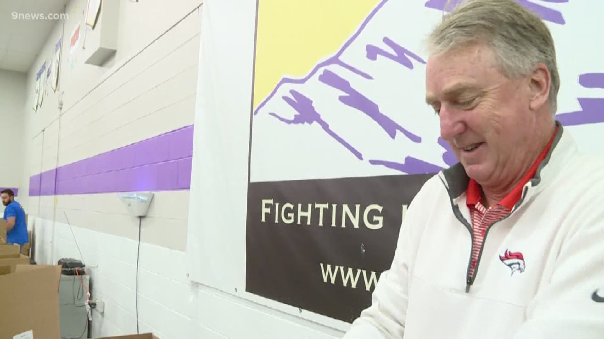 Denver Broncos CEO Joe Ellis and tight end Jeff Heuerman volunteered at the Food Bank of the Rockies on Friday.