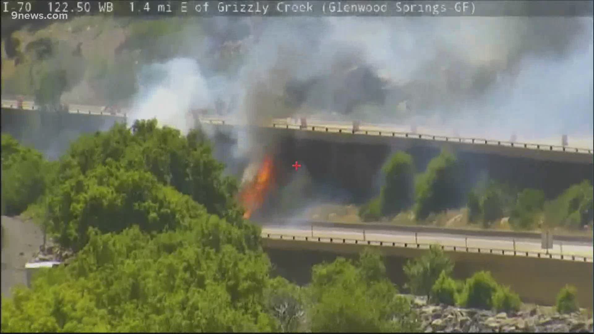 A fire burned between the lanes of Interstate 70 in Glenwood Canyon Wednesday afternoon.