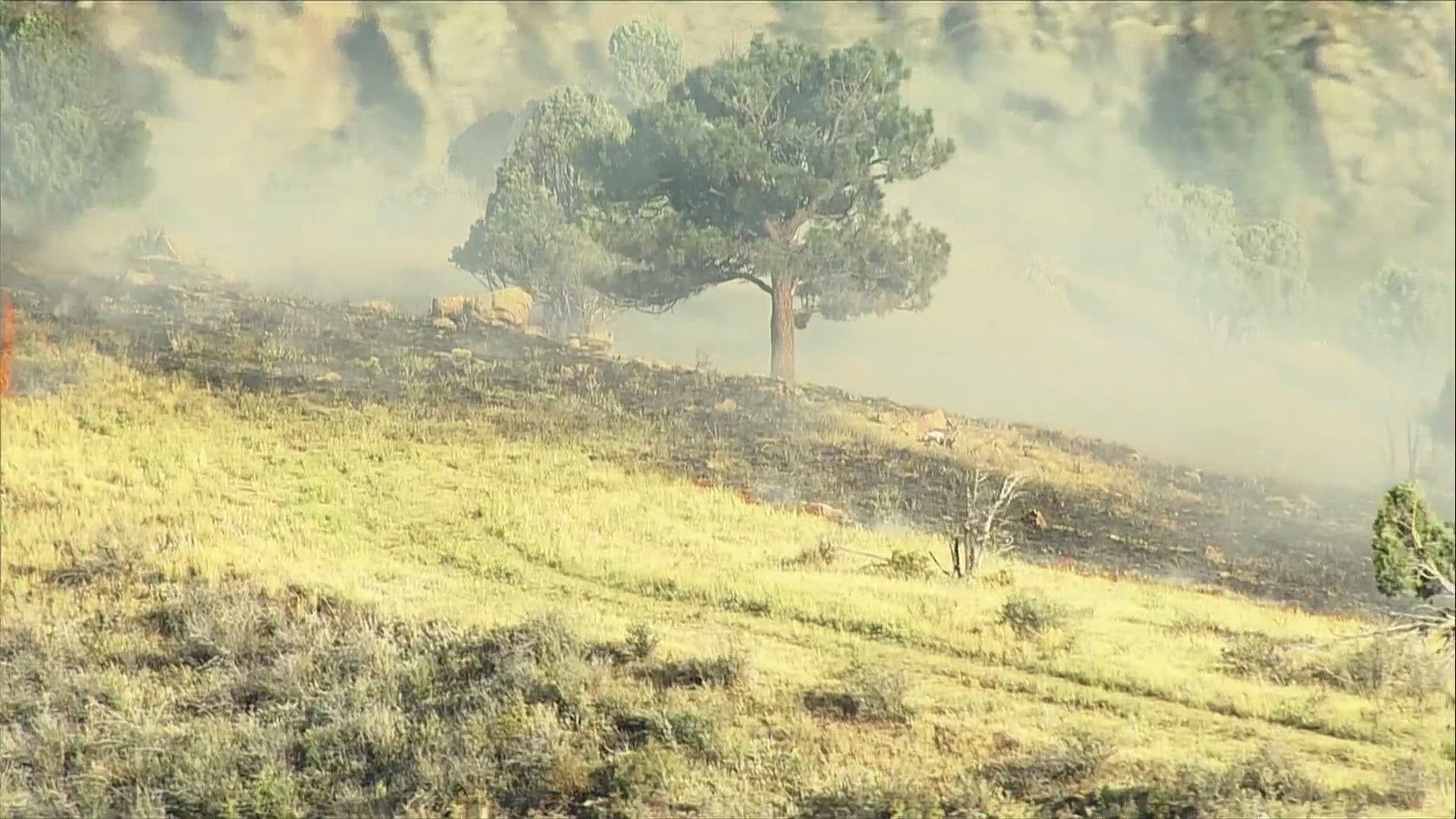 Smoke is visible Tuesday afternoon from a small brush fire burning in rugged terrain off Highway 6 in Jefferson County.