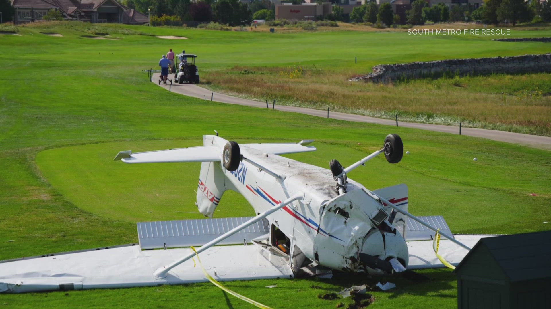 A single-engine airplane with two people on board crashed on a golf course in Douglas County Wednesday morning.