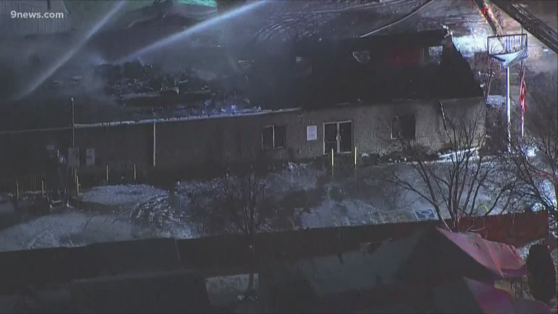 The fire broke out around 4 a.m. near Santa Fe Drive and West Dartmouth Avenue and destroyed the gun range.