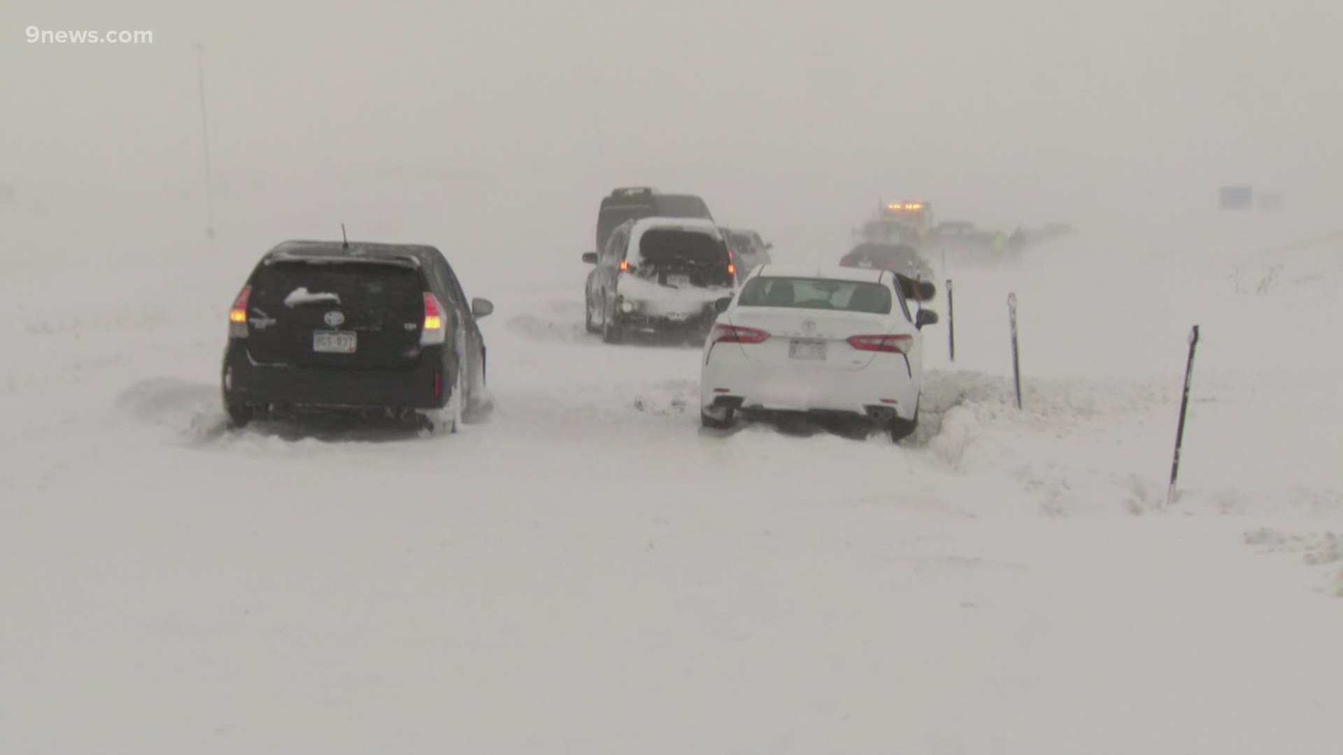 Cars were stranded in the snow near Denver International Airport as a blizzard warning was in effect for the Front Range.