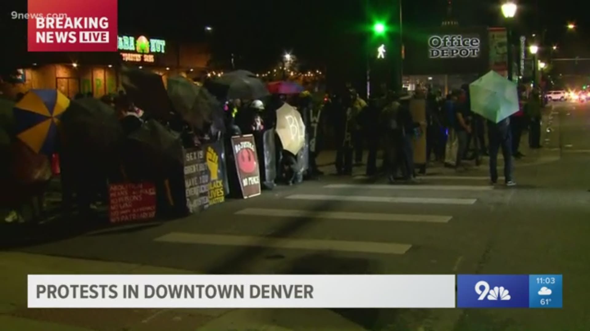 Police told a crowd to disperse while dressed in riot gear late Friday night.