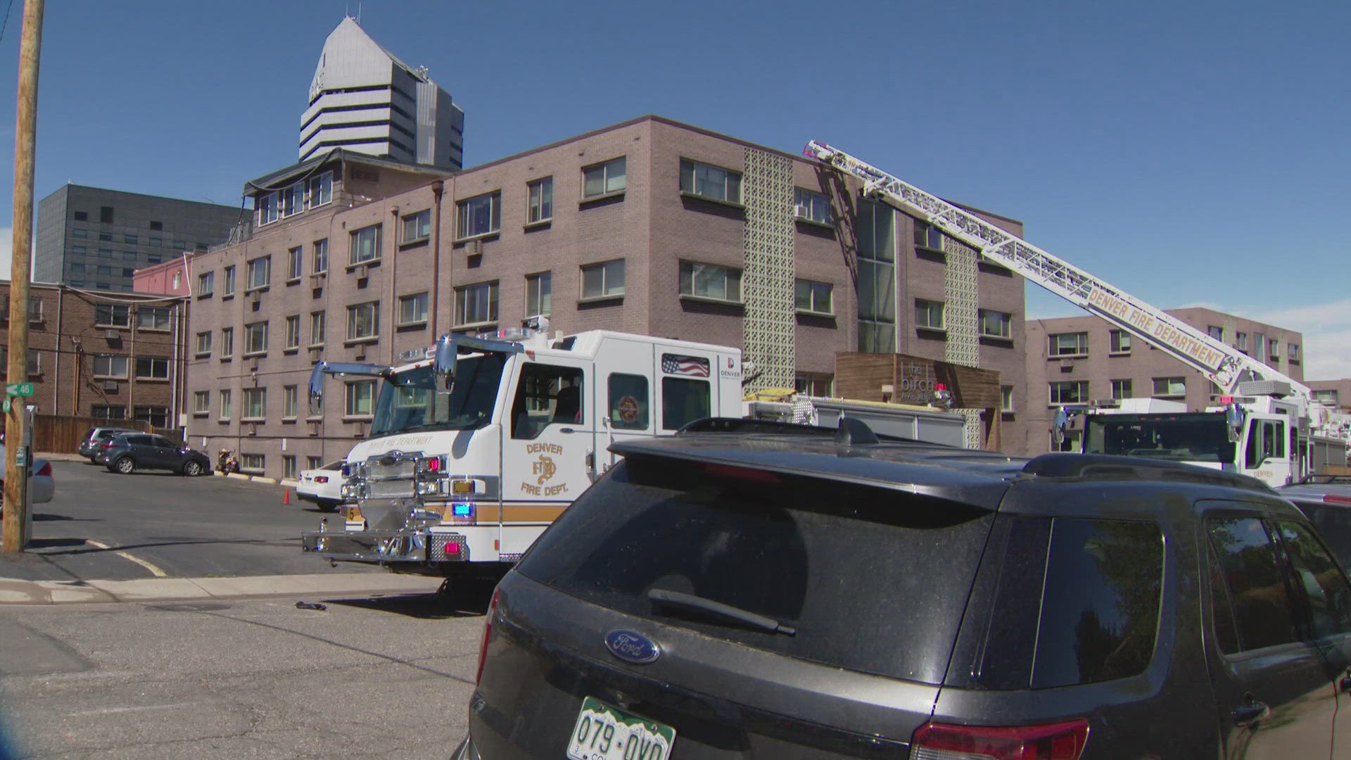 Firefighters used ladders to rescue several people stuck on the roof of ...