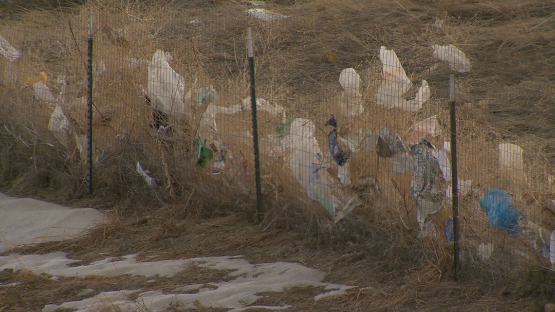 PHOTOS Residents believe trash from a nearby landfill is blowing into