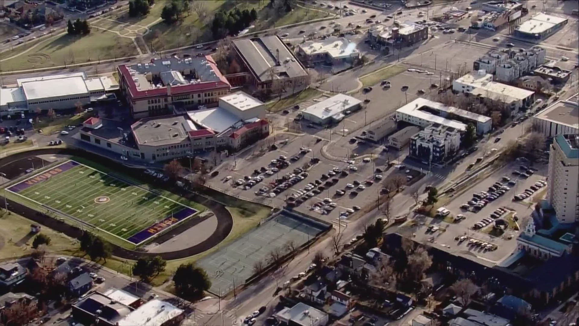 No one was injured when someone "randomly fired" into a car parked in the west auxiliary parking lot at North High School, school officials said.