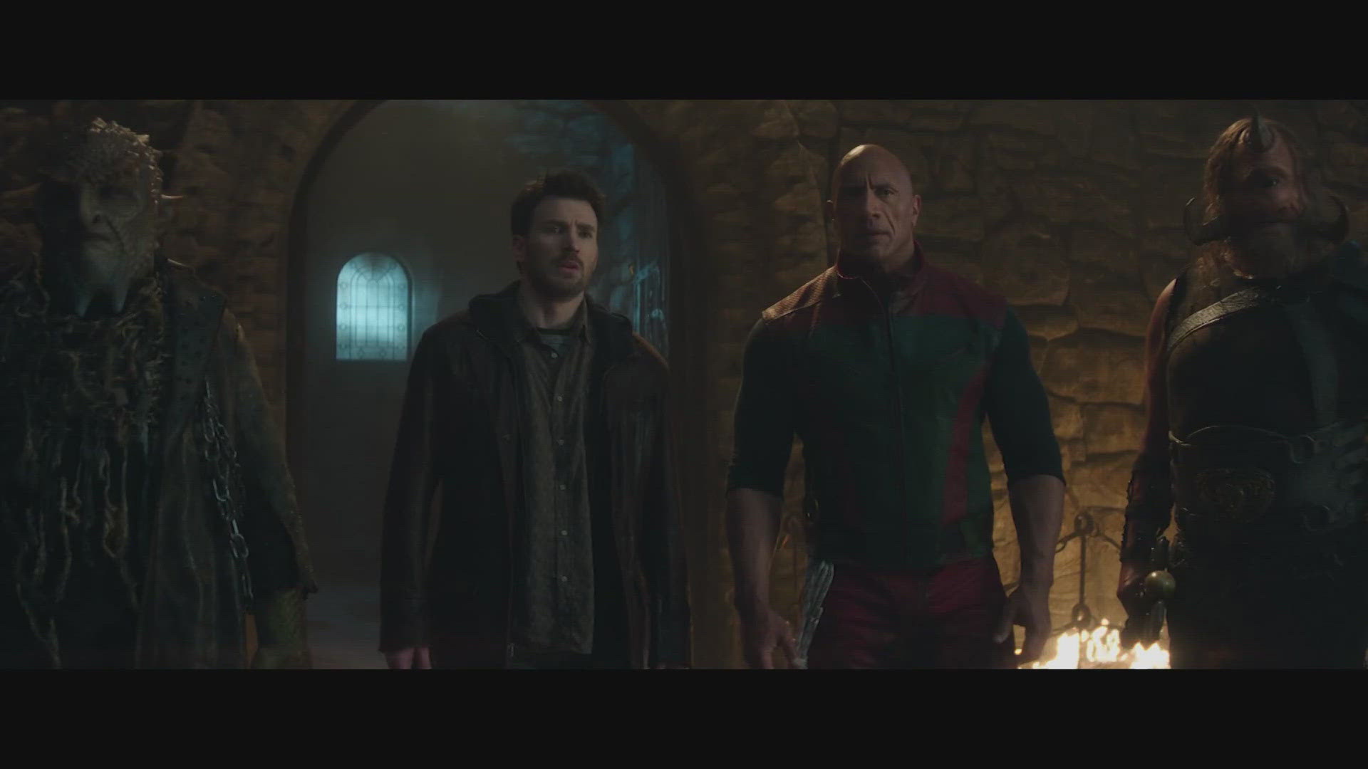 Chris Evans and Dwayne Johnson are suiting up to find Santa Claus in the first look at "Red One."