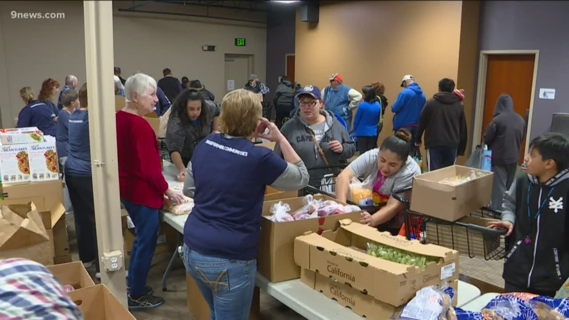 At one of the Food Bank of the Rockies mobile food pantries in Littleton, people line up on the second Wednesday of every month to get their next meal.