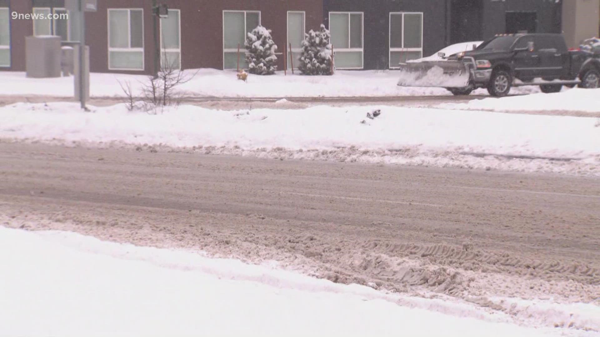 Reporter Angeline McCall has a look at road conditions in Denver's Central Park neighborhood following a winter storm that dumped heavy snow in the area.