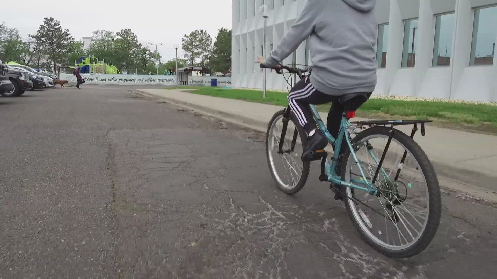 Leo Lopez cycles nine miles daily, representing a growing Montbello movement.