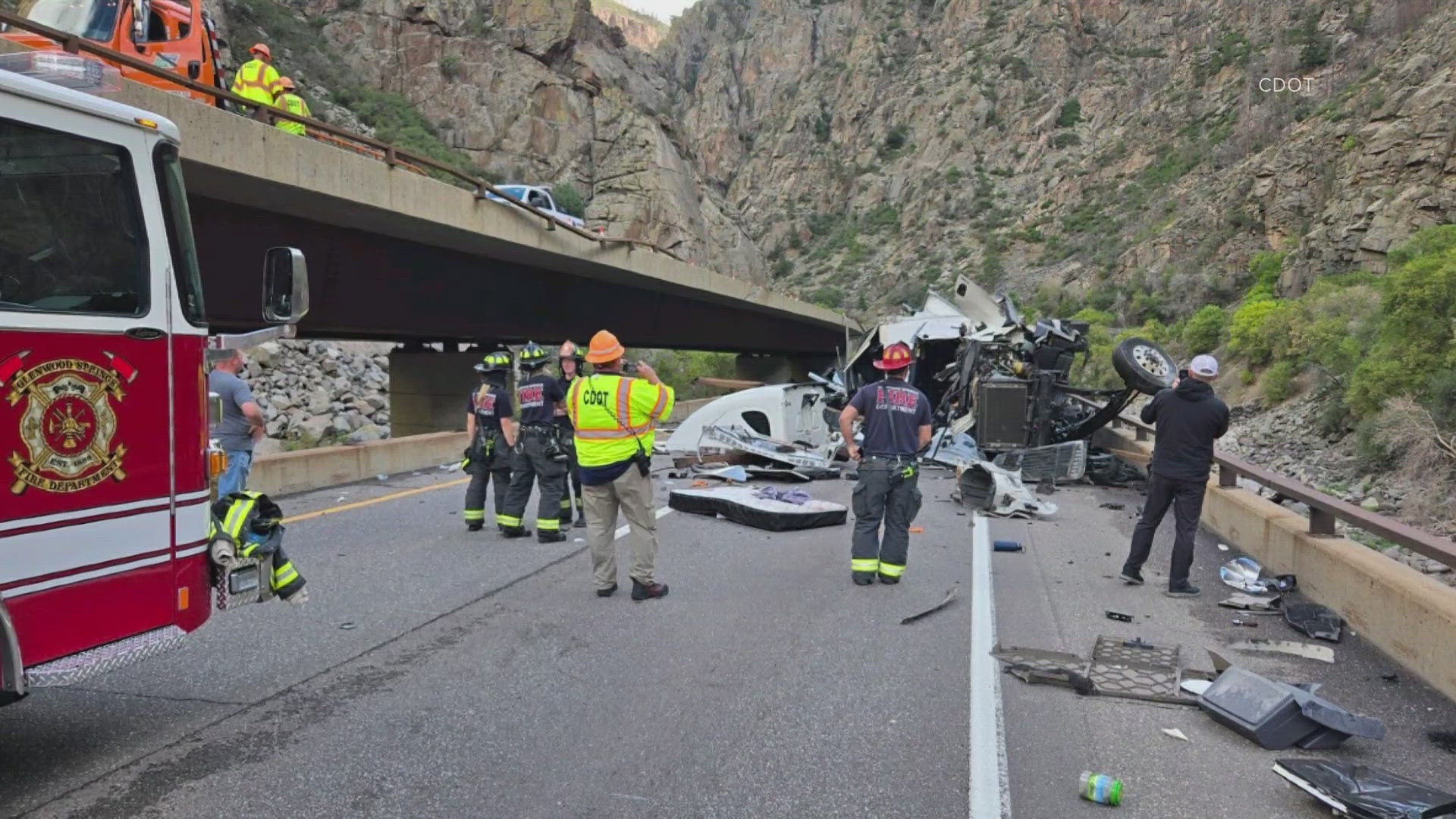 A semi truck rolled over in the westbound lanes and came to rest in the eastbound lanes, the Colorado State Patrol said.