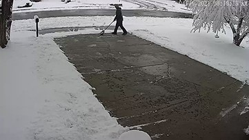 Man shoveling snow almost hit by falling branch during epic Colorado spring storm