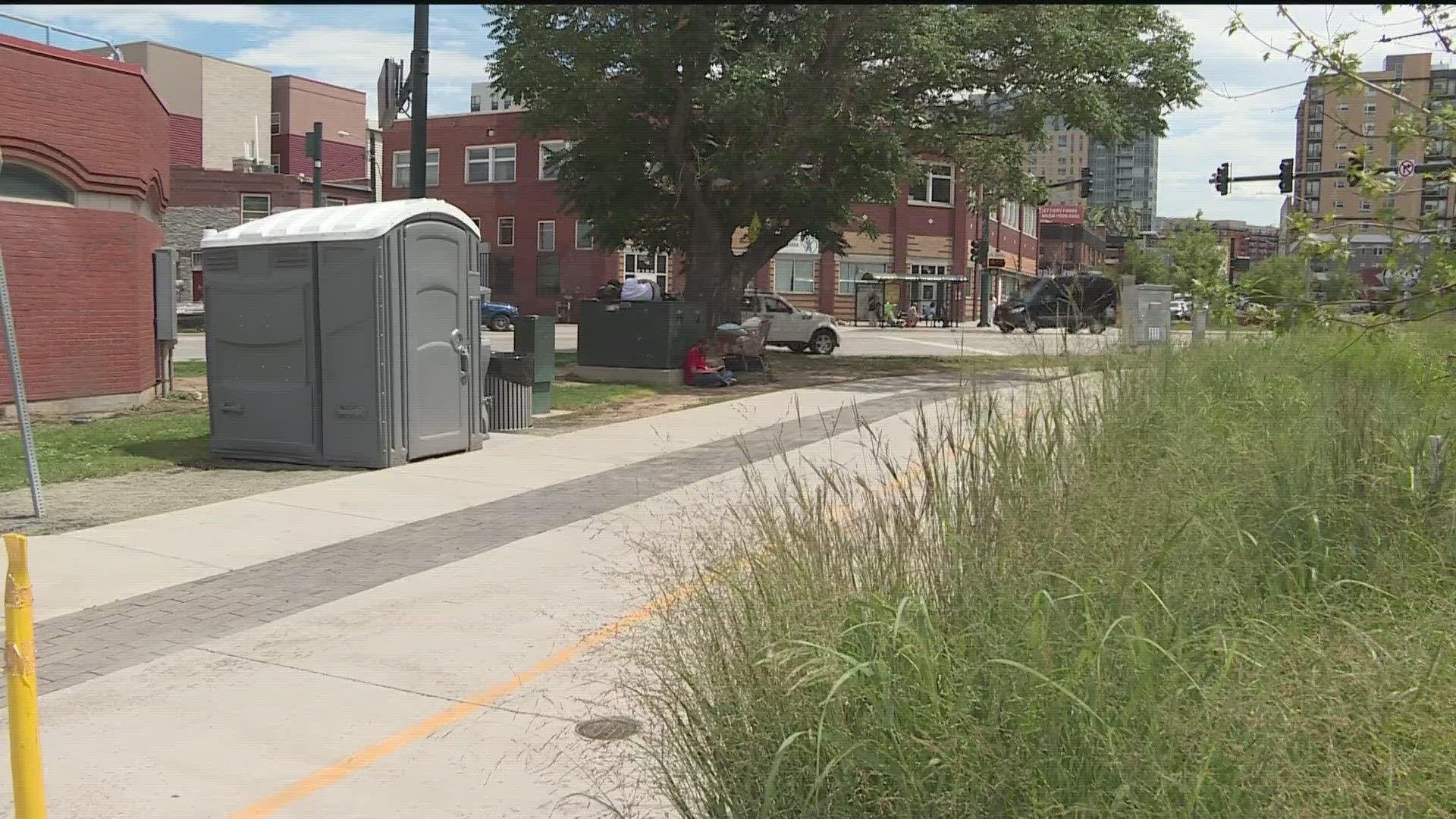 Denver's team trying to address homelessness in the city installed a portapotty with a trashcan and needle drop near an encampment downtown.