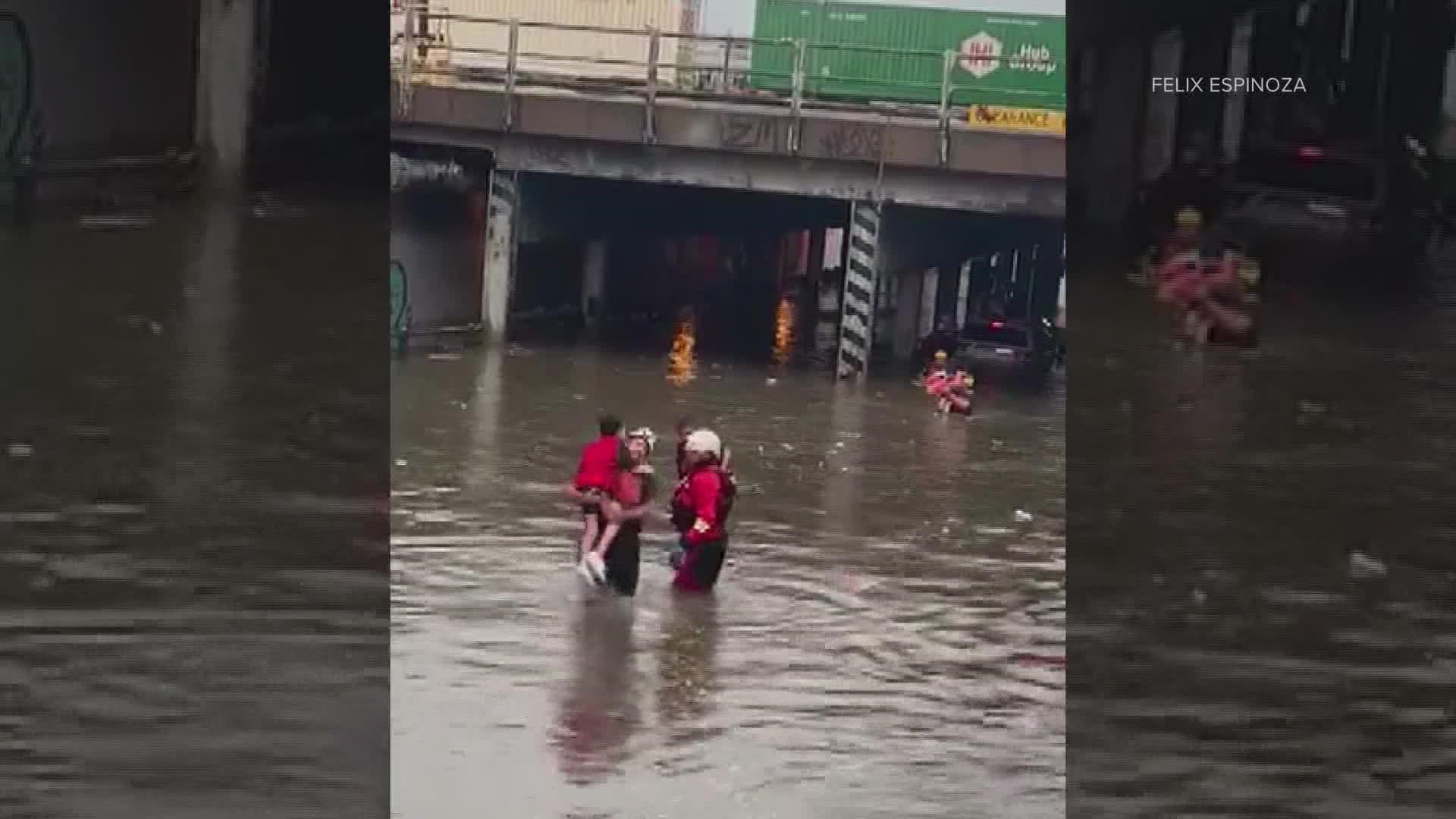 Denver Fire Department crews rescued 11 people in the area of I-70 and York Street and eight others in the area of 38th and Blake during flash flooding Sunday.