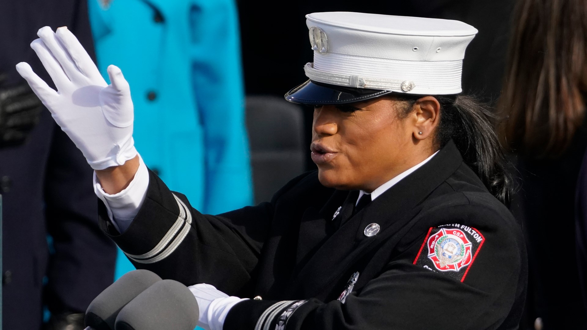 A fire captain led the Pledge of Allegiance using both her voice and sign language during the nationally televised event.