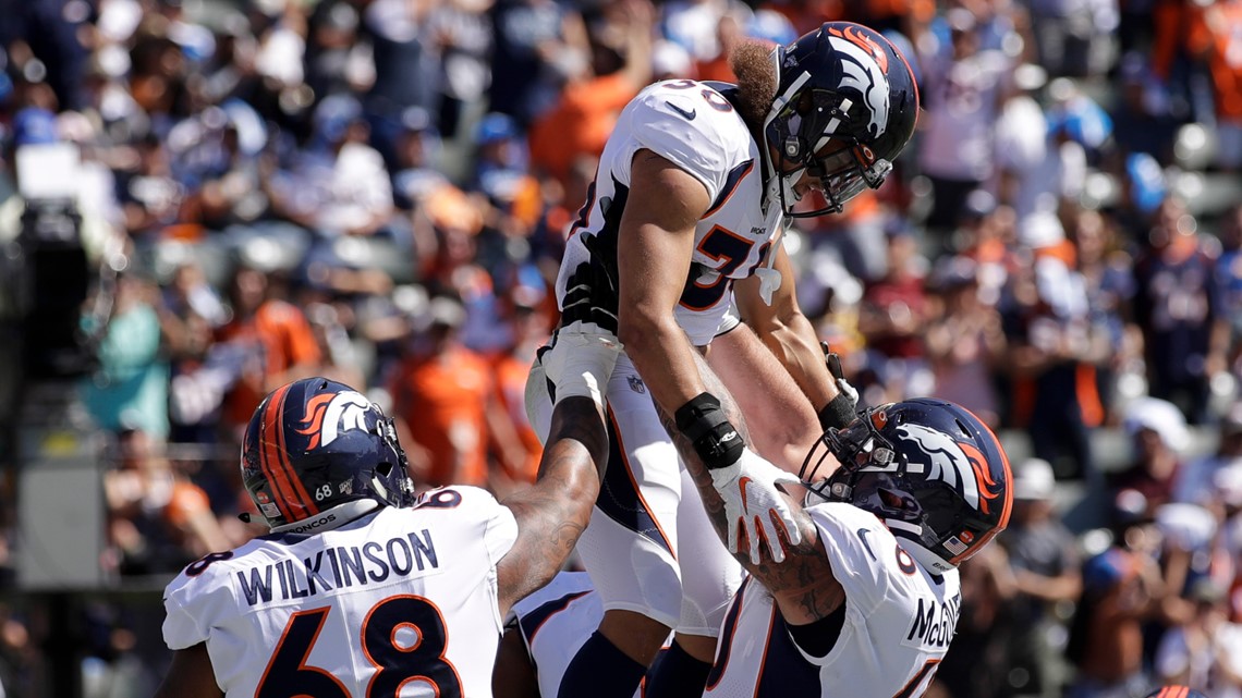 November 03, 2019: Denver Broncos running back Phillip Lindsay (30) is  congratulated during a timeout after his 16-yard sealed the win at the end  of the second half of the game between