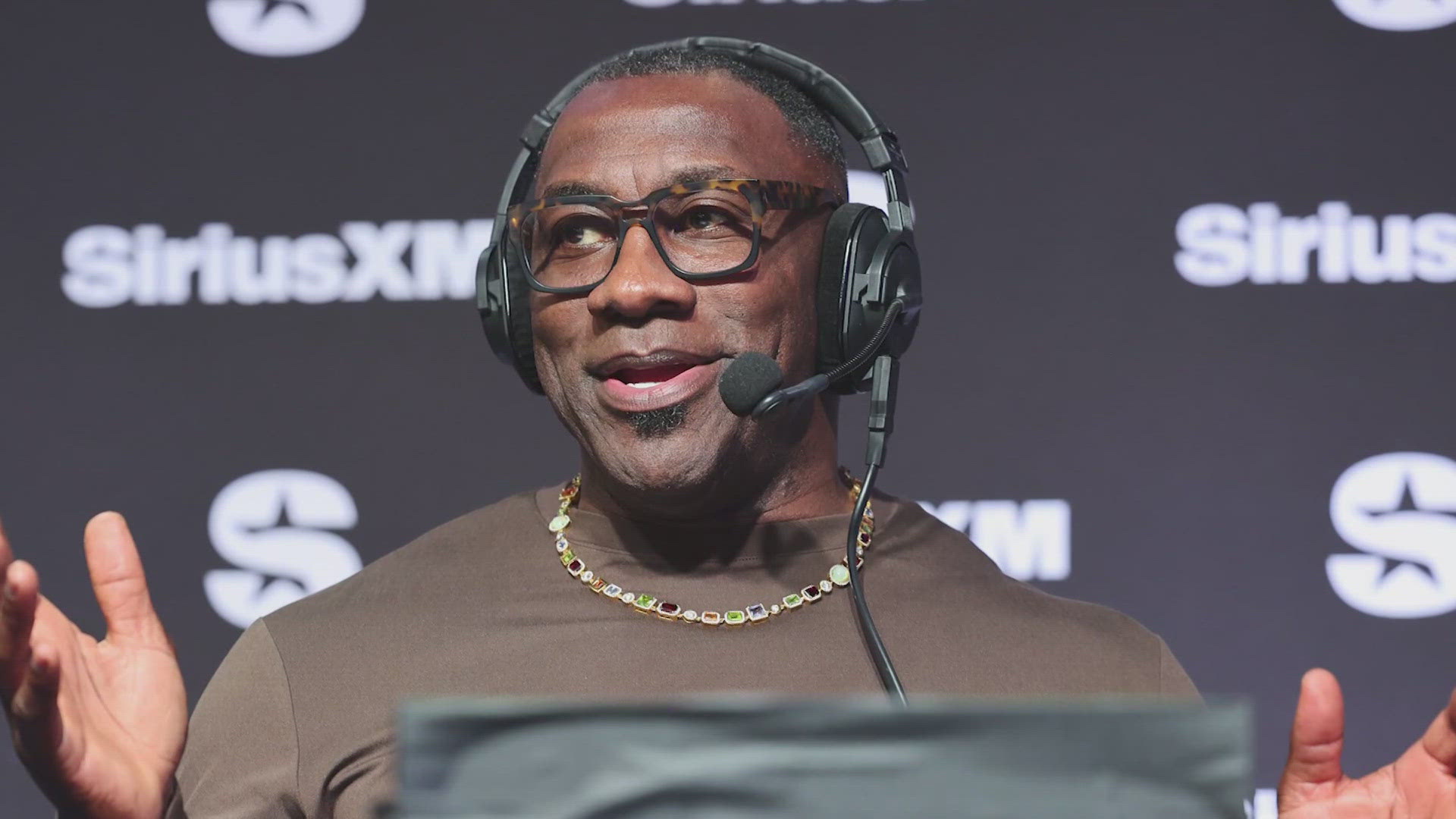 The former Denver Bronco stepped away from work at ESPN when the suit was filed, but pledged to return by the start of the NFL preseason.