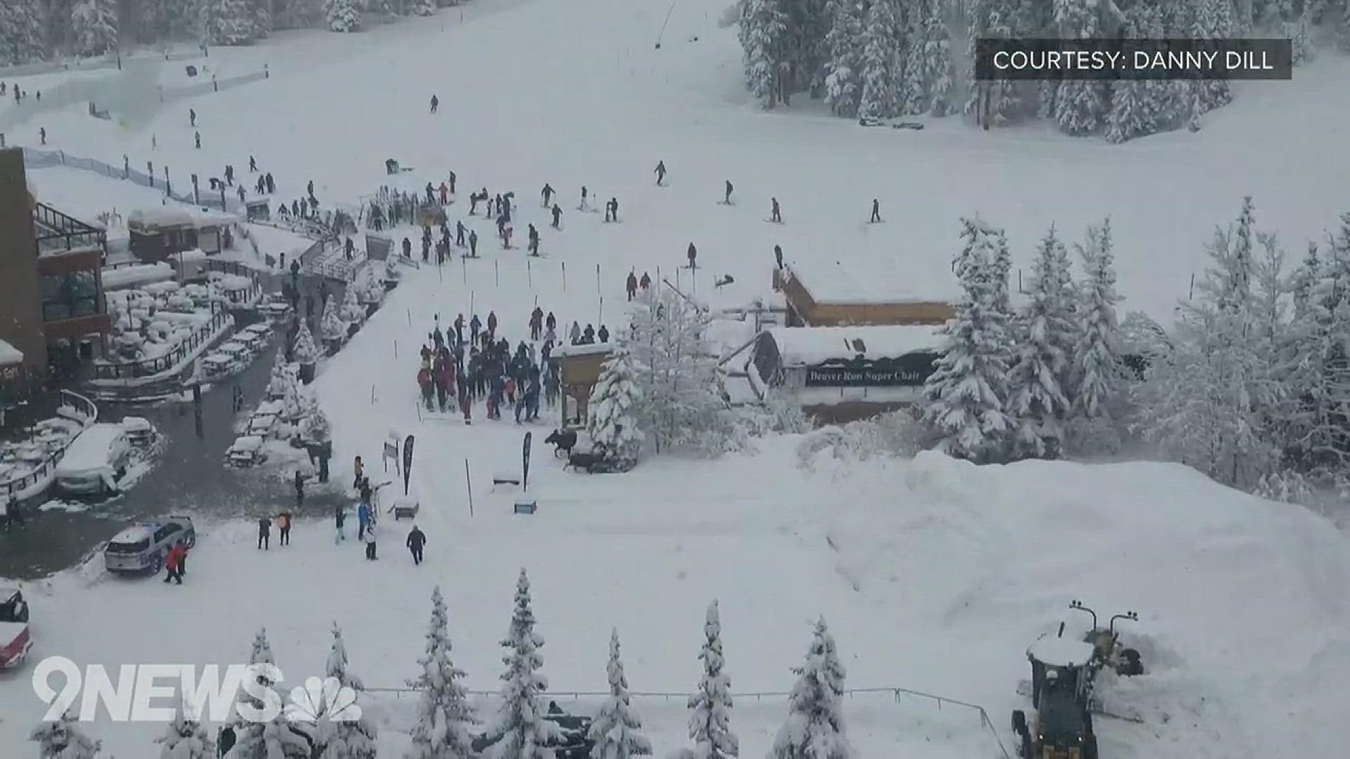 Two moose were caught on camera trotting through a crowd of skiers and snowboarders at the base of a lift at Breckenridge on Thursday. No one was hurt, according to the resort.