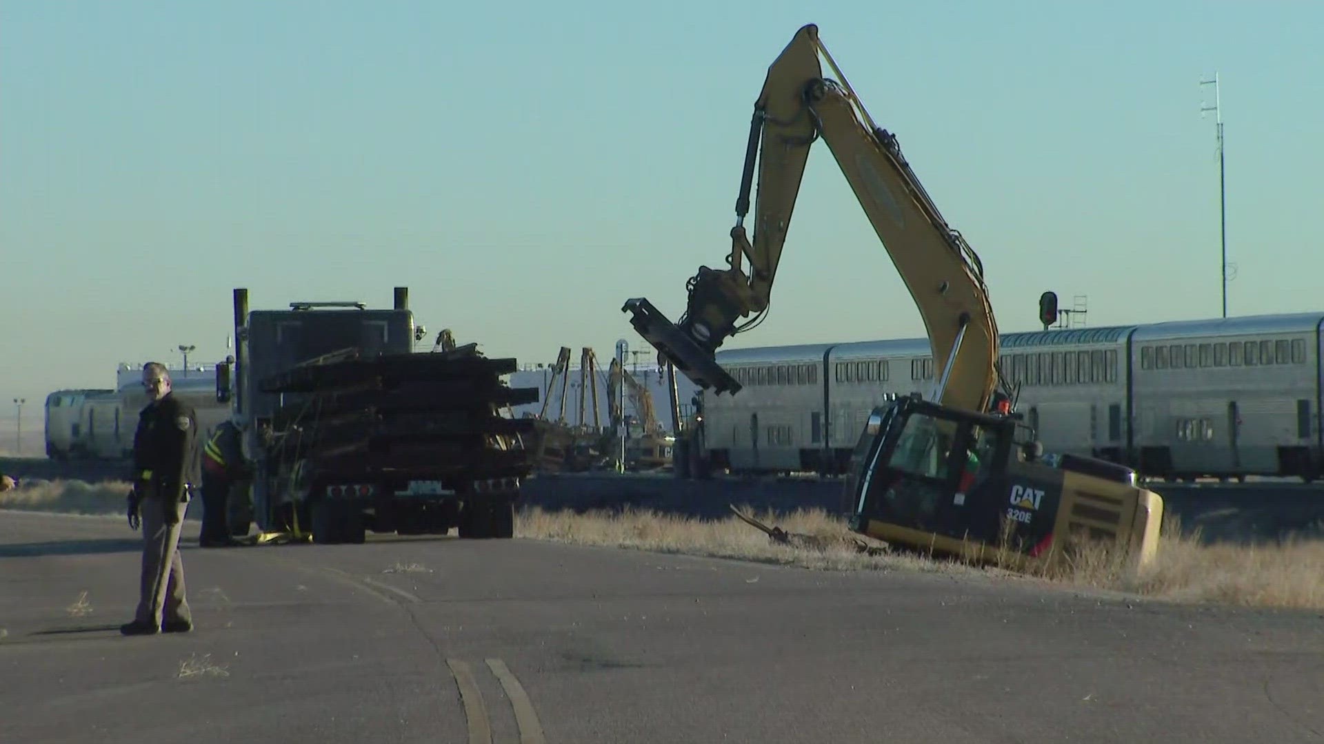 The train derailed after hitting a truck that was carrying milk near county roads 63 and 398 in Weld County.