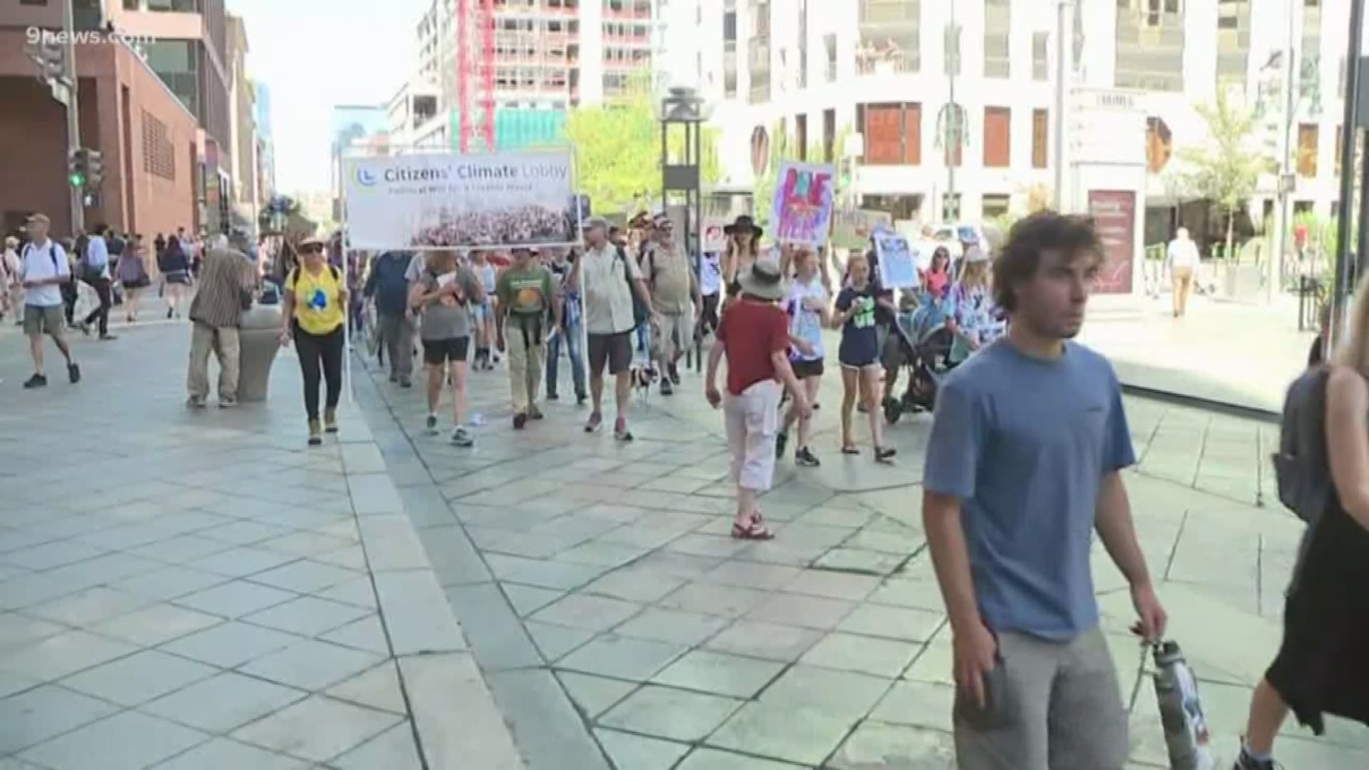 Protesters all over the world including Denver area gathering to demand action on climate change.