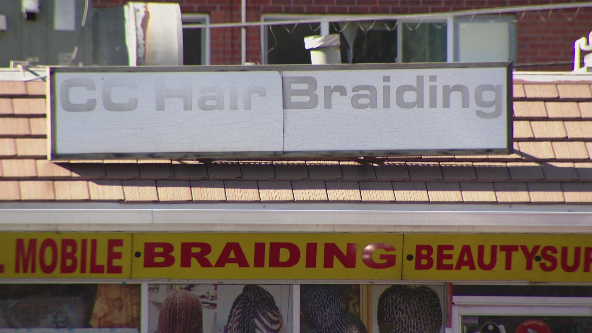 Madoussou Diakate owns CC Hairbraiding off of Peoria and Colfax in Aurora. She said business has been slow since a nearby apartment fire closed local roads.